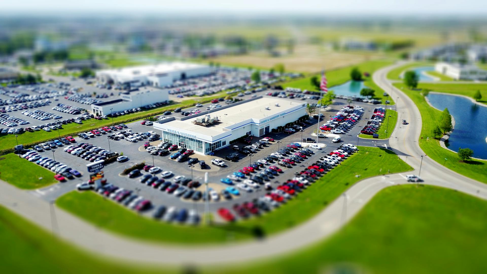 building with parking lot full of cars